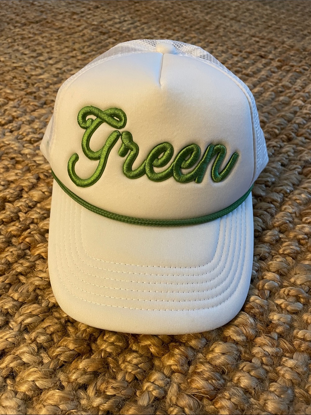 White Trucker Hat with Green Script Accent